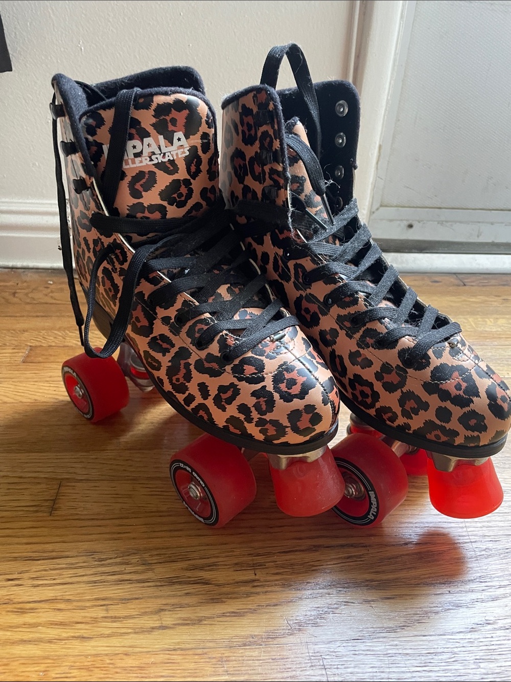 PAW Roller Skates for Women — Leopard Print in Pink & Black with Red Wheels